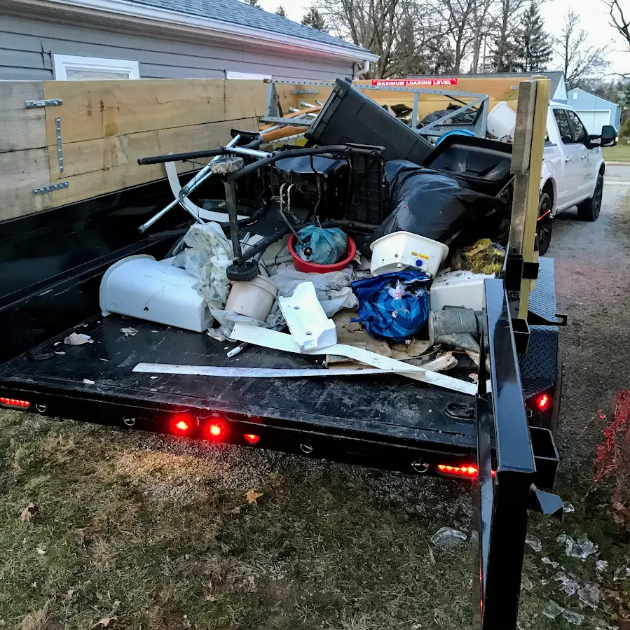Roll-off dumpster delivered to a residential driveway in Lower Grand Lagoon